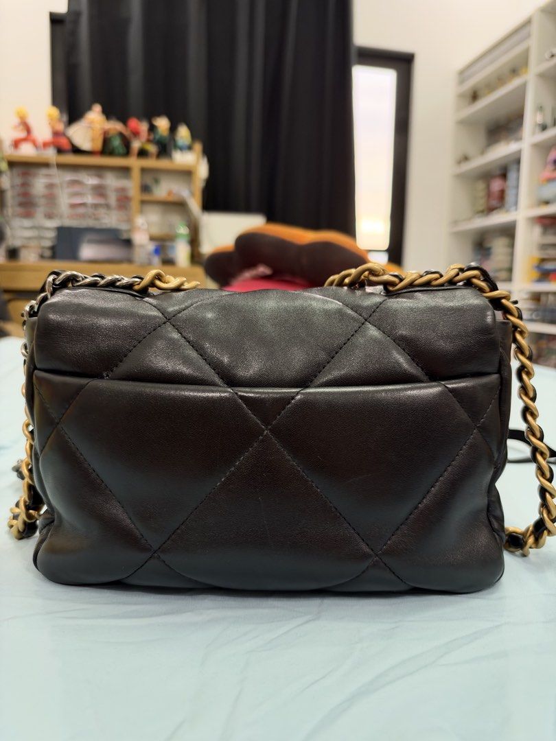 Chanel 19 Flap Bag Black (Category: Luxury Bags & Wallets) located in Bulacan. Submitted by rich3lle (Listing ID 1470831748, Image 2). Description: - Brand: Chanel - Material: Black quilted soft leather - Hardware: Chunky gold-tone CC turn-lock and mixed gold/ruthenium chain strap - Exterior: Classic quilted pattern on body and sides, convenient back slip pocket - Structure: Structured shape with soft leather construction - Condition: Excellent (