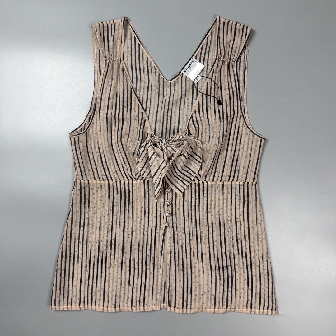 Chanel - 03A Fall - Striped Silk Chiffon Bow Blouse Top (Category: Sleeveless) located in Pasig City. Submitted by on_the_trend (Listing ID 1470803634, Image 1). Description: Tagged size: 42 Condition: 9/10 Material: 96% Silk, 4% Spandex Made in: Italy Details: - Collection: Fall 2003 (03A) - Style Code: P21770W03195 / M2008 - Material: Sheer Silk Chiffon (Blend tag shown in photos) Please note that this item is sheer and does not come with a lin