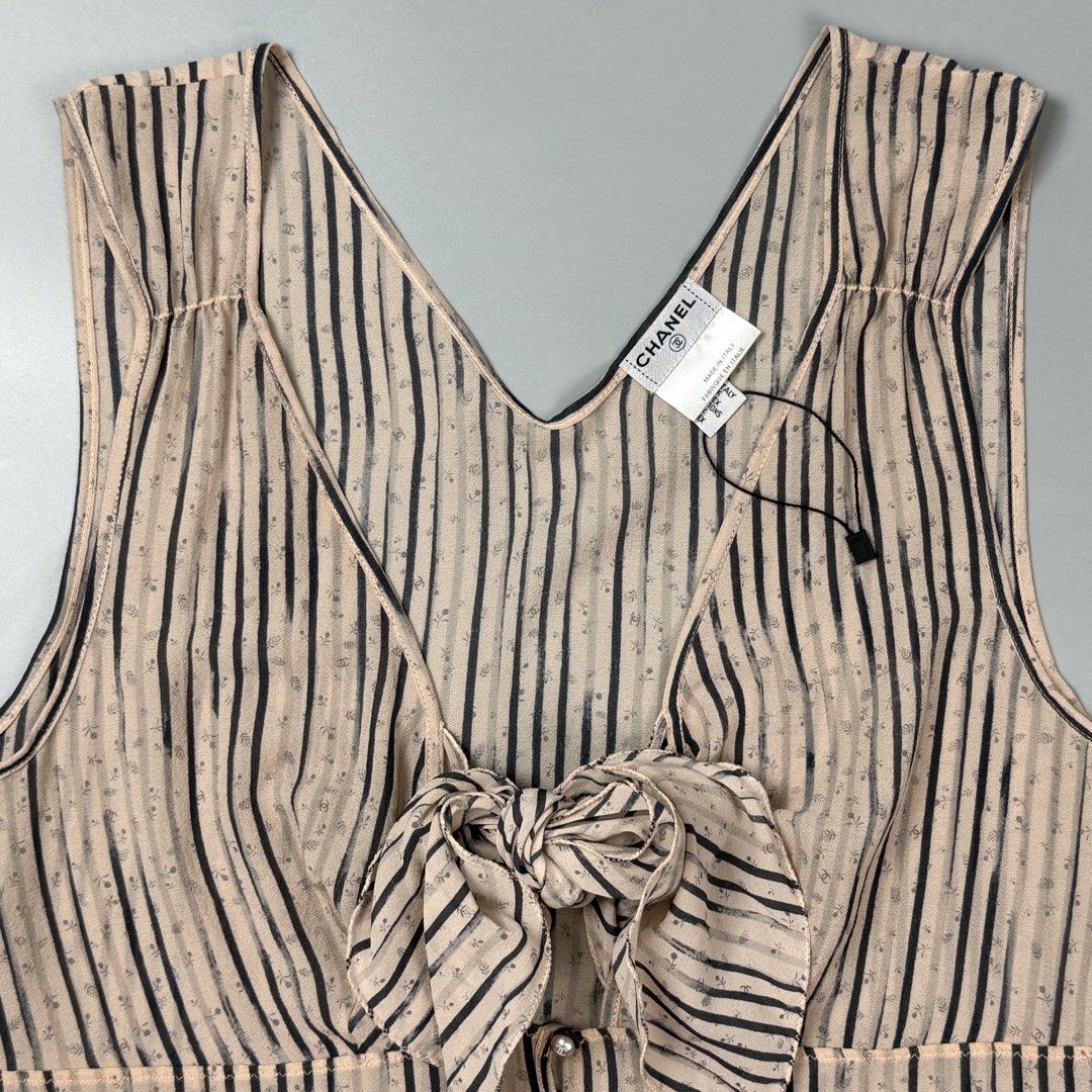 Chanel - 03A Fall - Striped Silk Chiffon Bow Blouse Top (Category: Sleeveless) located in Pasig City. Submitted by on_the_trend (Listing ID 1470803634, Image 3). Description: Tagged size: 42 Condition: 9/10 Material: 96% Silk, 4% Spandex Made in: Italy Details: - Collection: Fall 2003 (03A) - Style Code: P21770W03195 / M2008 - Material: Sheer Silk Chiffon (Blend tag shown in photos) Please note that this item is sheer and does not come with a lin