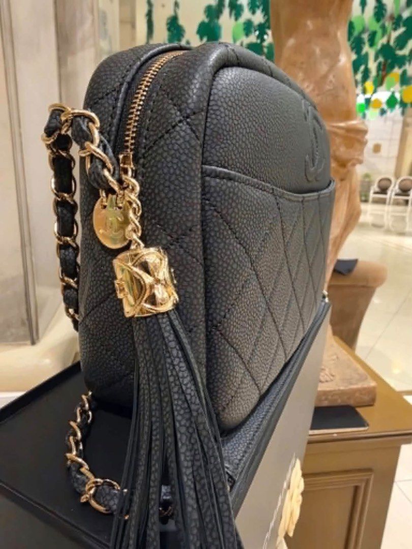 Chanel Black Caviar Leather Camera Bag with Tassel (Category: Luxury Bags & Wallets) located in Caloocan City. Submitted by mms.10 (Listing ID 1470857253, Image 2). Description: - Authentic Chanel camera bag in classic black caviar leather - Features signature quilted pattern and stitched interlocking CC logo - Elegant gold-tone hardware with leather-woven chain strap - Includes matching leather tassel charm with gold CC accent - Comes complete w