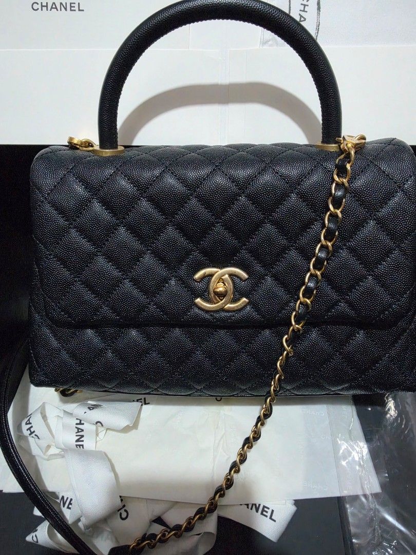 Chanel Black Caviar Leather Handle Flap Bag (Category: Luxury Bags & Wallets) located in Las Pinas. Submitted by swiftdragon_0c099a (Listing ID 1470889496, Image 2). Description: Authentic black caviar leather Chanel flap bag with gold hardware, top handle, and removable chain strap. Features the iconic CC turn-lock closure and quilted design. Comes complete with its original box and dust bags. PM to order! .