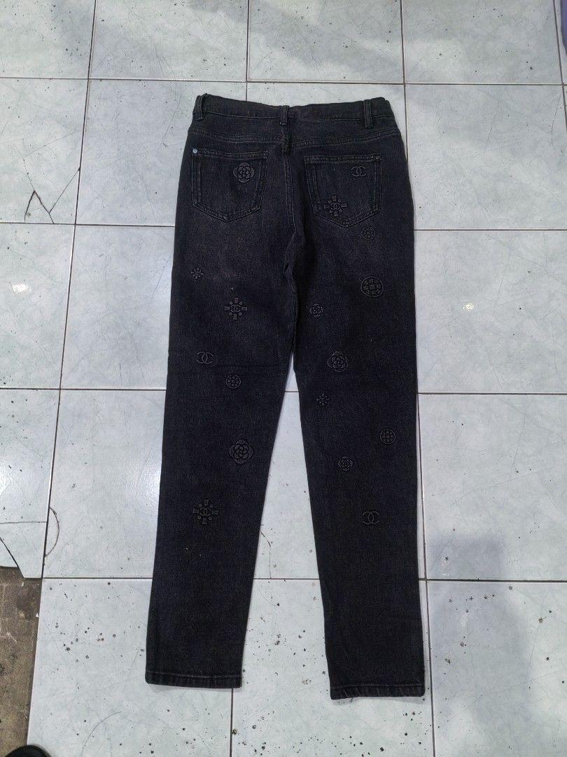 Chanel Black Patterned Stretch Jeans Size 40 (Category: Jeans) located in Batangas. Submitted by human.made (Listing ID 1470746639, Image 2). Description: - Brand: Chanel - Type: Dark wash stretch denim jeans - Size: Tagged size 40 - Size 30 to 32 actual size - Design: Tonal black embossed patterns featuring iconic CC logos and camellia motifs - Details: Classic 5-pocket styling, button closure with branded hardware, and interior stretch tape tri