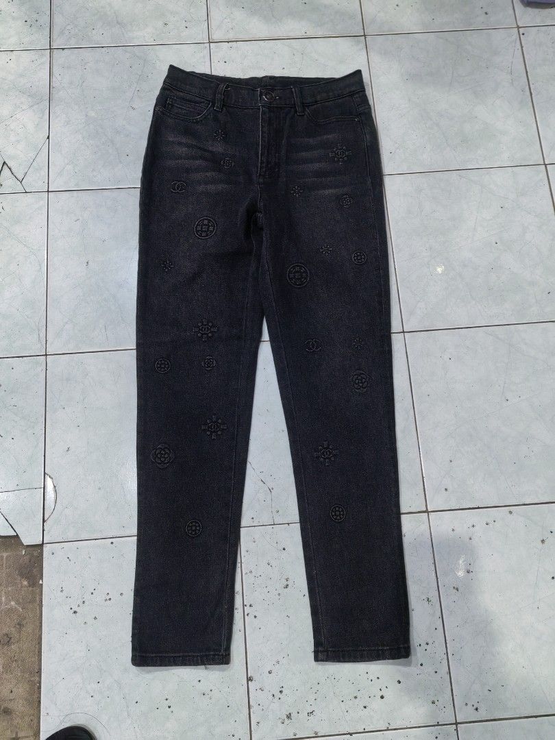 Chanel Black Patterned Stretch Jeans Size 40 (Category: Jeans) located in Batangas. Submitted by human.made (Listing ID 1470746639, Image 1). Description: - Brand: Chanel - Type: Dark wash stretch denim jeans - Size: Tagged size 40 - Size 30 to 32 actual size - Design: Tonal black embossed patterns featuring iconic CC logos and camellia motifs - Details: Classic 5-pocket styling, button closure with branded hardware, and interior stretch tape tri
