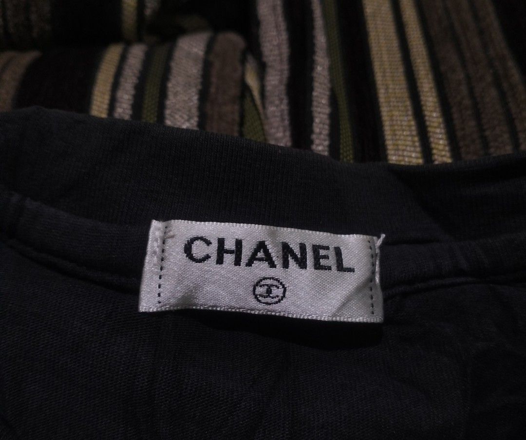 Chanel Black T-Shirt (Category: Shirts) located in Taguig. Submitted by conniemdcruz (Listing ID 1470916881, Image 2). Description: - Brand: Chanel - Color: Classic black - Material: Soft, comfortable cotton - Design: Crew neck with inside collar label, straight hemline - Style: Simple everyday wear, versatile dark tone Chanel Medium women's 18x24 Excellent condition 400.