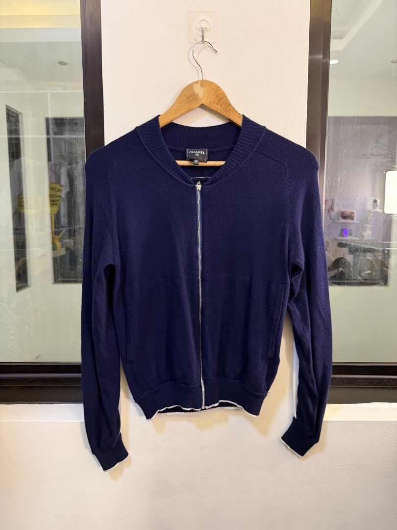 CHANEL Full-Zip Knit Cardigan Jacket (Category: Coats, Jackets and Outerwear) located in Paranaque City. Submitted by preluxeshop_ph (Listing ID 1470811602, Image 2). Description: Brand: CHANEL -Style: Full-Zip Knit Cardigan Jacket / Zip-Up Sweater -Color: Navy Blue with white trim piping along the hem and shoulders -Design Features: Large embroidered line-art tiger graphic across the back, full front zipper closure, white contrast accent trim fr