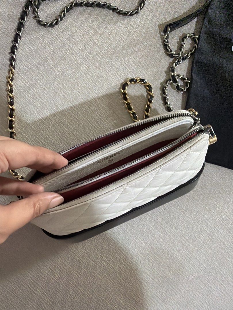 Chanel Gabrielle Small Hobo Bag White Black (Category: Luxury Bags & Wallets) located in Paranaque City. Submitted by alexagamboa (Listing ID 1470808032, Image 2). Description: - Brand: Chanel - Style: Gabrielle Small Hobo Bag - Color: White quilted leather with a solid black structured base - Hardware: Mixed silver-tone and gold-tone with interwoven leather strap - Closure: Top zip with iconic CC logo zipper pull - Inclusion: Original black Chan