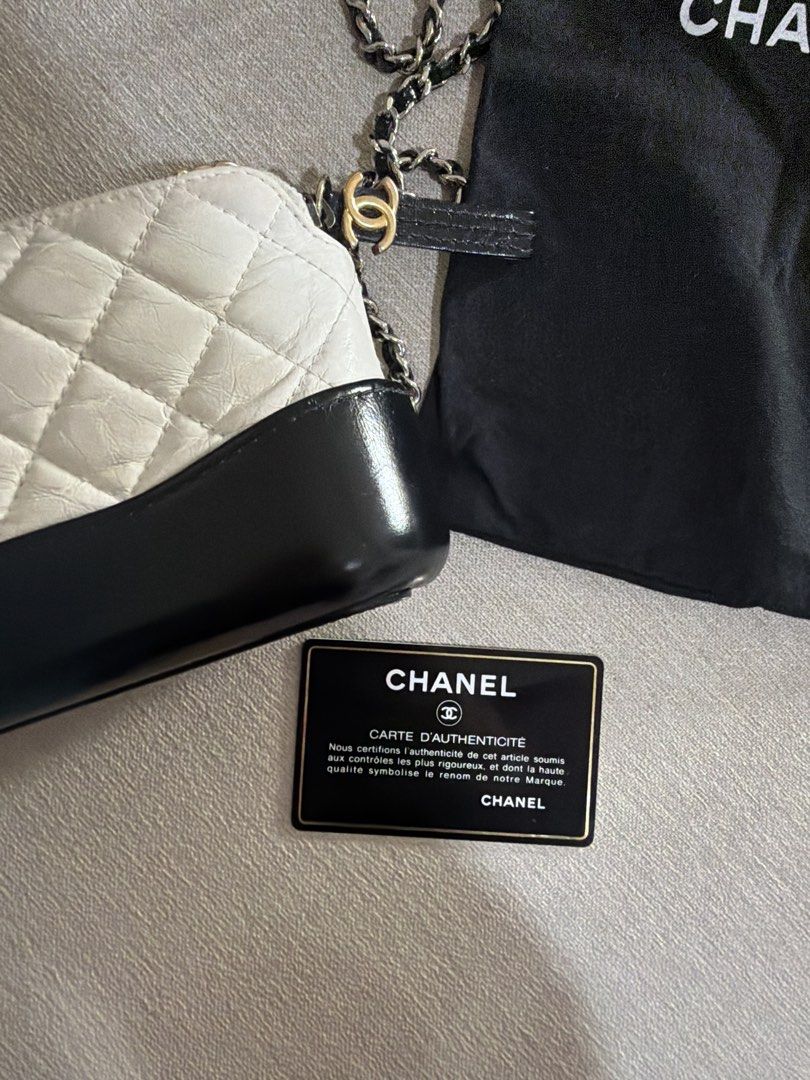 Chanel Gabrielle Small Hobo Bag White Black (Category: Luxury Bags & Wallets) located in Paranaque City. Submitted by alexagamboa (Listing ID 1470808032, Image 3). Description: - Brand: Chanel - Style: Gabrielle Small Hobo Bag - Color: White quilted leather with a solid black structured base - Hardware: Mixed silver-tone and gold-tone with interwoven leather strap - Closure: Top zip with iconic CC logo zipper pull - Inclusion: Original black Chan