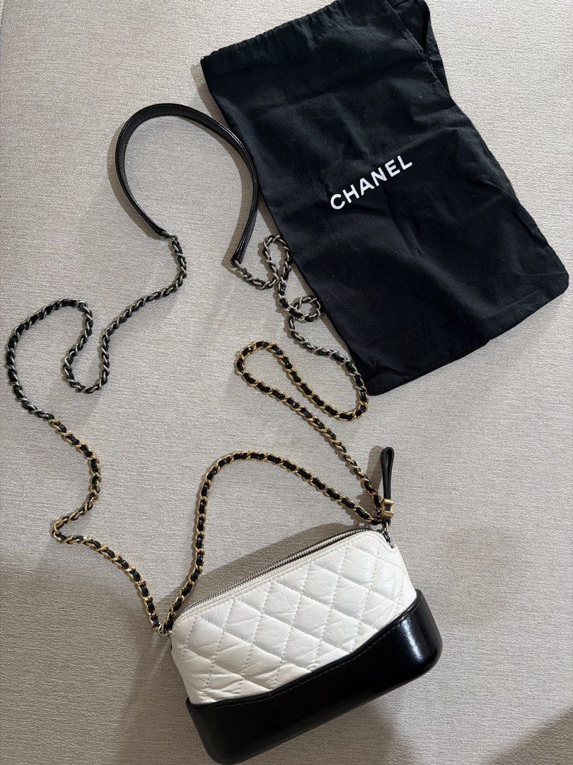 Chanel Gabrielle Small Hobo Bag White Black (Category: Luxury Bags & Wallets) located in Paranaque City. Submitted by alexagamboa (Listing ID 1470808032, Image 1). Description: - Brand: Chanel - Style: Gabrielle Small Hobo Bag - Color: White quilted leather with a solid black structured base - Hardware: Mixed silver-tone and gold-tone with interwoven leather strap - Closure: Top zip with iconic CC logo zipper pull - Inclusion: Original black Chan