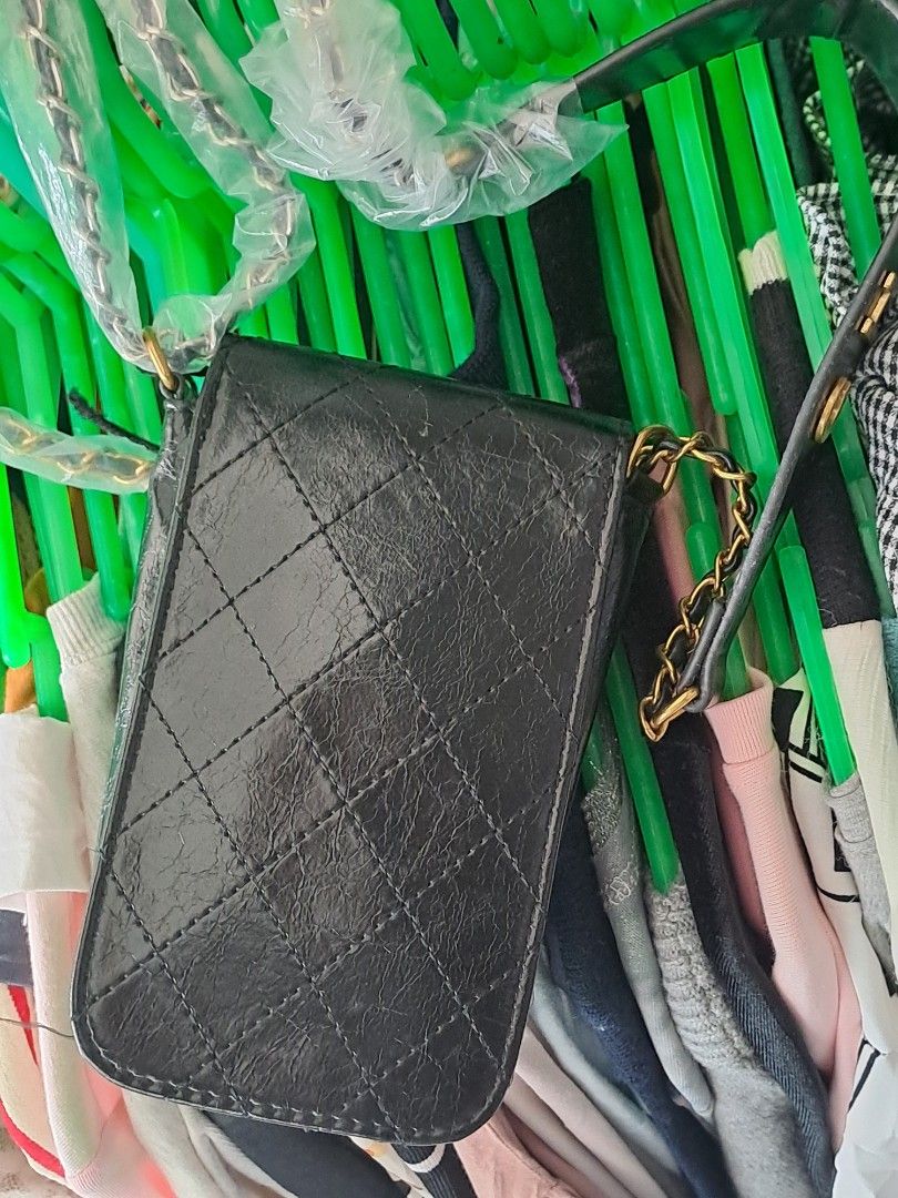 Chanel Makeup Crossbody Bag (Category: Luxury Bags & Wallets) located in Narra. Submitted by jervs29corner (Listing ID 1470835760, Image 2). Description: - Chanel makeup bag converted into a stylish crossbody - Eye-catching gold-tone interlocking CC turnlock closure on the front flap - Interior stamped with official Chanel Makeup branding - Statement chunky gold chain and black leather strap accented with large gold Chanel lettering - Compact and