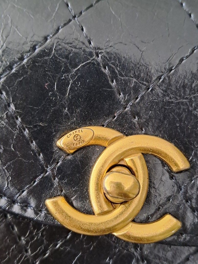 Chanel Makeup Crossbody Bag (Category: Luxury Bags & Wallets) located in Narra. Submitted by jervs29corner (Listing ID 1470835760, Image 3). Description: - Chanel makeup bag converted into a stylish crossbody - Eye-catching gold-tone interlocking CC turnlock closure on the front flap - Interior stamped with official Chanel Makeup branding - Statement chunky gold chain and black leather strap accented with large gold Chanel lettering - Compact and