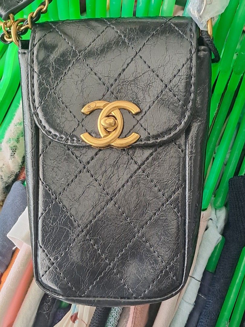 Chanel Makeup Crossbody Bag (Category: Luxury Bags & Wallets) located in Narra. Submitted by jervs29corner (Listing ID 1470835760, Image 1). Description: - Chanel makeup bag converted into a stylish crossbody - Eye-catching gold-tone interlocking CC turnlock closure on the front flap - Interior stamped with official Chanel Makeup branding - Statement chunky gold chain and black leather strap accented with large gold Chanel lettering - Compact and