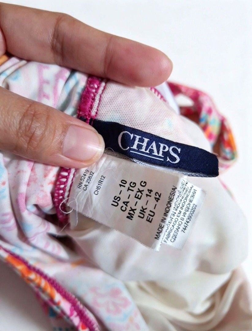 Chaps Skirted One-Piece Swimsuit Size US 10 (Category: Bikinis & Swimsuits) located in Quezon City. Submitted by ana-chan (Listing ID 1470784160, Image 3). Description: - Brand: Chaps - Style: One-piece swimsuit with skirted bottom - Print/Color: Vibrant colorful paisley - Size: US 10 / UK 14 / EU 42 (MEDIUM-LARGE - Features: Supportive front ruching, adjustable halter ties, and built-in shelf bra - Origin: Made in Indonesia - Condition: Great br