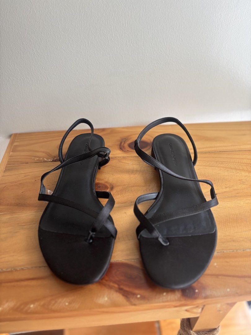 Charles & Keith Arden Satin Wavy Toe-Ring Sandals (Category: Flats & Sandals) located in Mandaluyong City. Submitted by kthln (Listing ID 1470772376, Image 1). Description: - Brand/Model: Charles & Keith Arden Satin Wavy Toe-Ring Sandals - Size: 38 (marked on sole) - With box Bought from Changi Airport RFS: I realized the size is too big after using it once. .