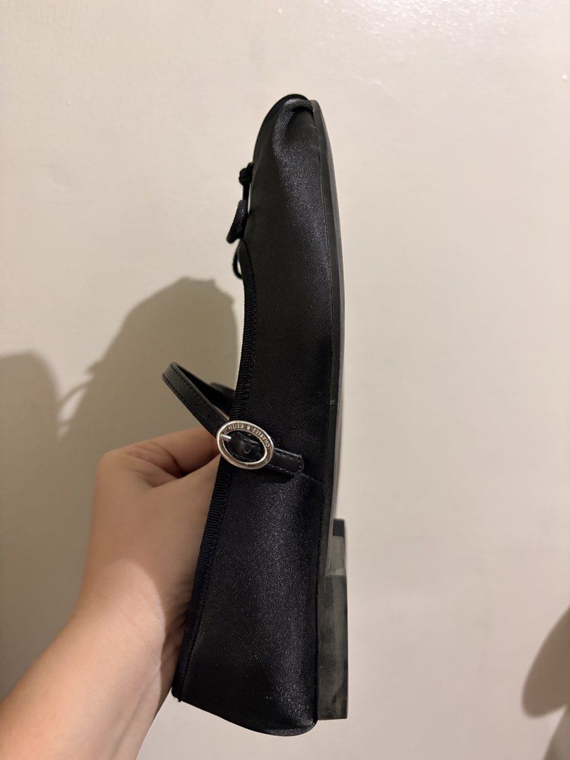 Charles & Keith Black Mary Jane Flats Size 36 (Category: Flats & Sandals) located in Quezon City. Submitted by djmcderay (Listing ID 1470758772, Image 3). Description: - Brand: Charles & Keith - Style: Black satin Mary Jane flats with a charming toe bow and buckled strap - Size: EU 36 / PH 6 - Soles: Flat heels with rubber grip for anti-slip - Condition: Clean insoles with clear branding; light wear on bottom soles - Great for work, casual outing