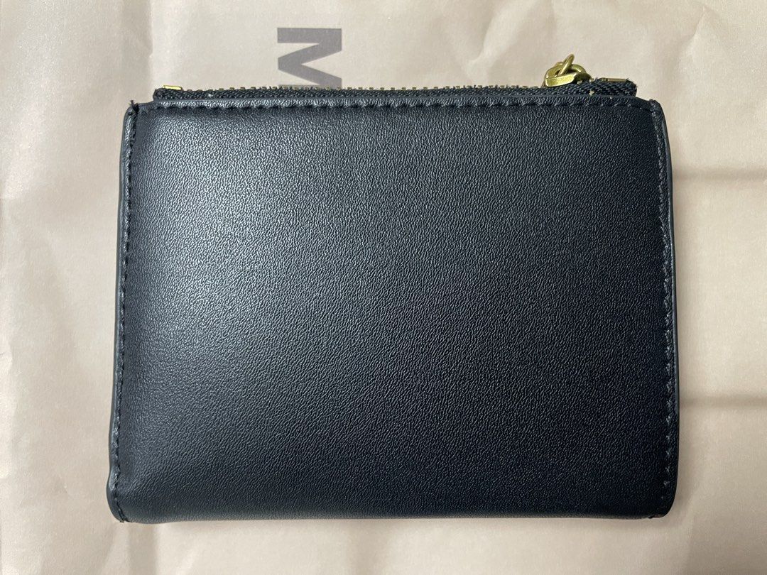 Charles & Keith Black Wallet (Category: Wallets & Card holders) located in Manila. Submitted by zngrl (Listing ID 1470837718, Image 2). Description: - Brand: Charles & Keith - Color: Classic Black with elegant gold-tone hardware - Branding: Stamped zipper pull and clear gold front lettering - Closure: Fold-over snap closure with a zippered top coin compartment - Size: Compact and practical for daily cards and cash NEVER USED. WITH PAPER BAG.