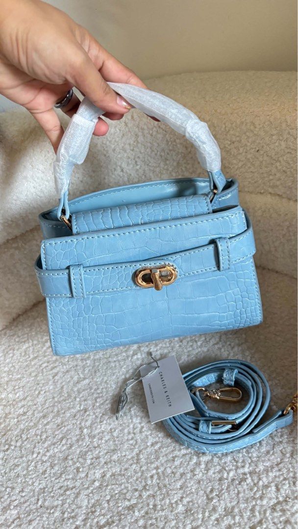 CHARLES & KEITH CROC-EFFECT BELTED TOP HANDLE BAG (Category: Cross-body Bags) located in Taguig. Submitted by renzms (Listing ID 1470816024, Image 2). Description: • with eco bag & paper bag • on hand & ready to ship • actual photos | what you see is what you exactly get! • shipping nationwide via tiktok co.