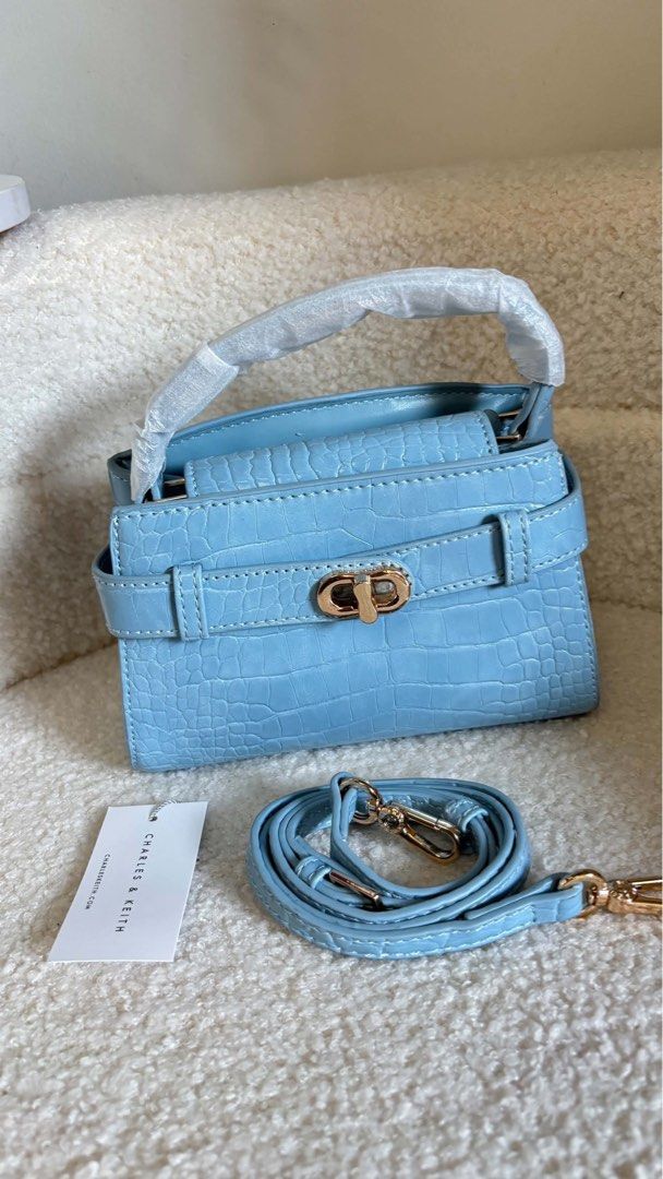 CHARLES & KEITH CROC-EFFECT BELTED TOP HANDLE BAG (Category: Cross-body Bags) located in Taguig. Submitted by renzms (Listing ID 1470816024, Image 1). Description: • with eco bag & paper bag • on hand & ready to ship • actual photos | what you see is what you exactly get! • shipping nationwide via tiktok co.