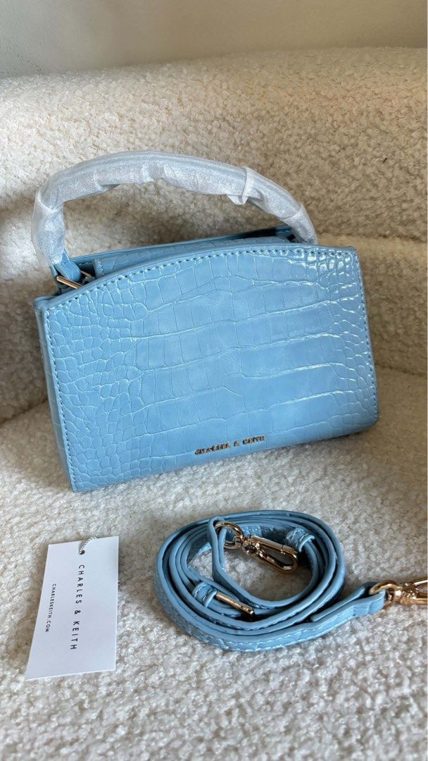 CHARLES & KEITH CROC-EFFECT BELTED TOP HANDLE BAG (Category: Cross-body Bags) located in Taguig. Submitted by renzms (Listing ID 1470816024, Image 3). Description: • with eco bag & paper bag • on hand & ready to ship • actual photos | what you see is what you exactly get! • shipping nationwide via tiktok co.
