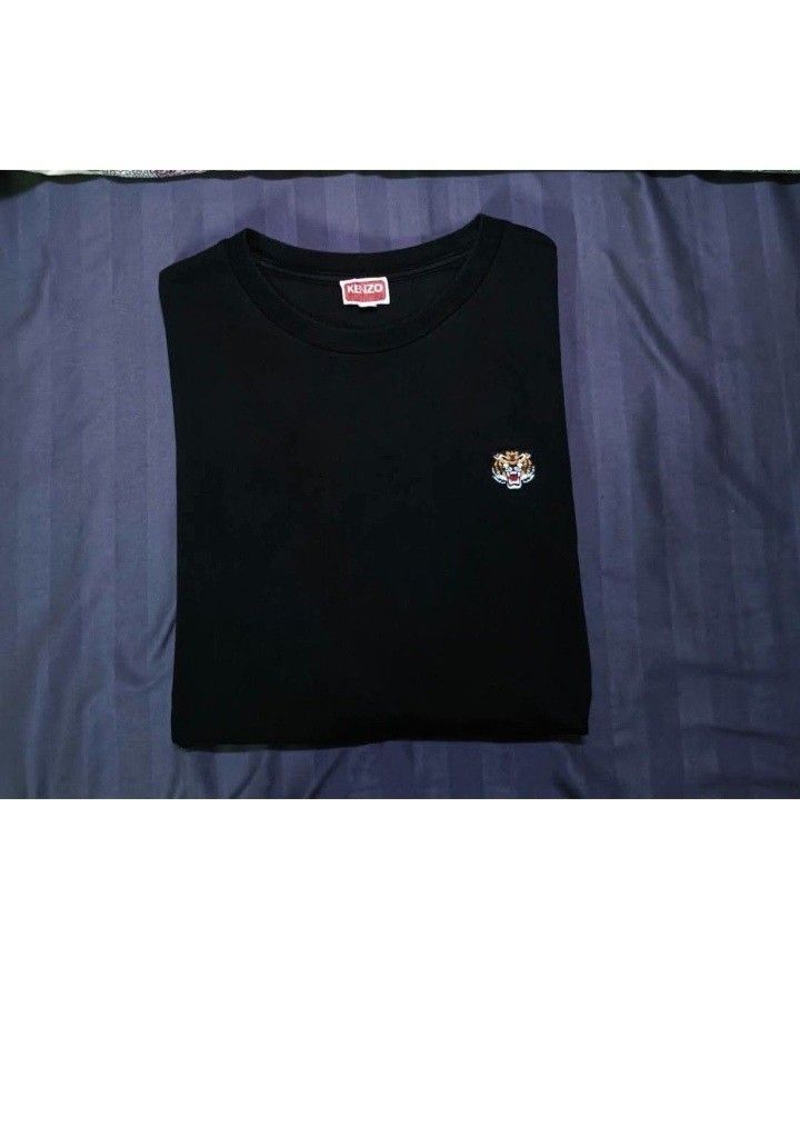 Check out 'Authentic KENZO Lucky Tiger', available at PHP 1,499 (Category: Formal Shirts) located in Manila. Submitted by mikahelmen14622 (Listing ID 1470797828, Image 2). Description: Check out 'Authentic KENZO Lucky Tiger', available at PHP 1,499 Armpit 20 Lenght 30 fittings is Large Excellent Condition issue 0..