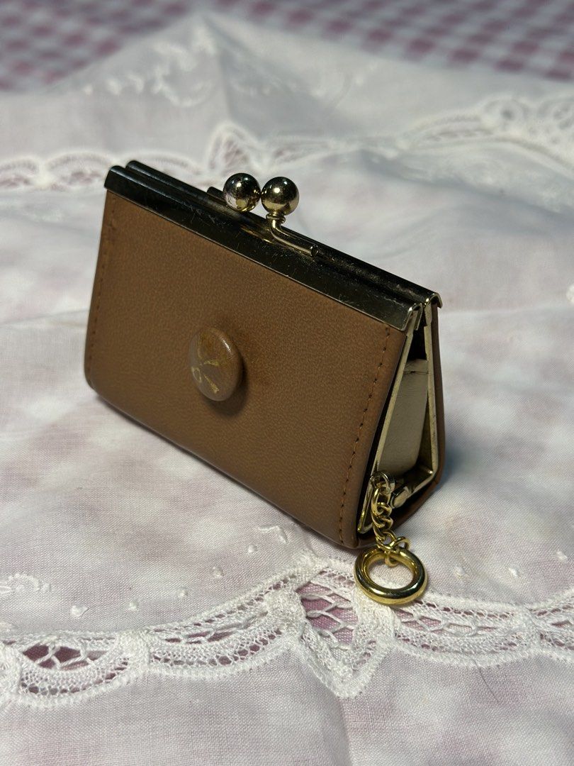 Choco brown kisslock leather wallet, small size (Category: Purses & Pouches) located in Davao. Submitted by favoritepreloved (Listing ID 1470814021, Image 1). Description: 💜 5.5cm height x 8.25cm x 3cm thickness.