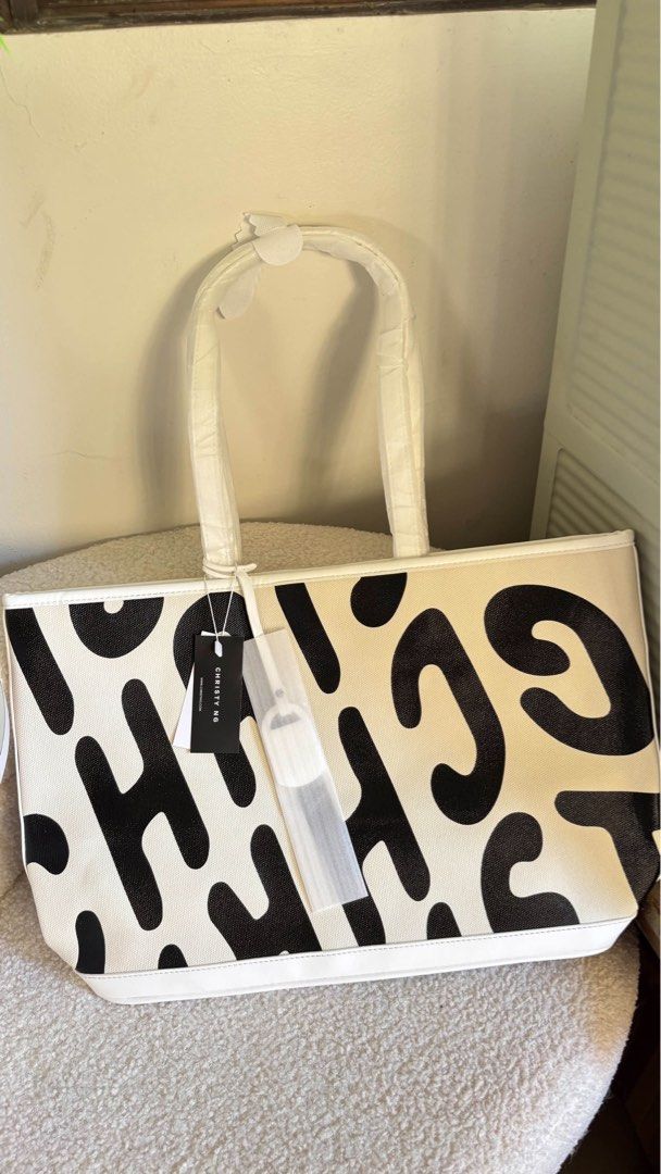 Christ Ng Logo Tote (Category: Tote Bags) located in Taguig. Submitted by renzms (Listing ID 1470816410, Image 1). Description: • with dust bag only • on hand & ready to ship • actual photos | what you see is what you exactly get! • shipping nationwide via tiktok co.