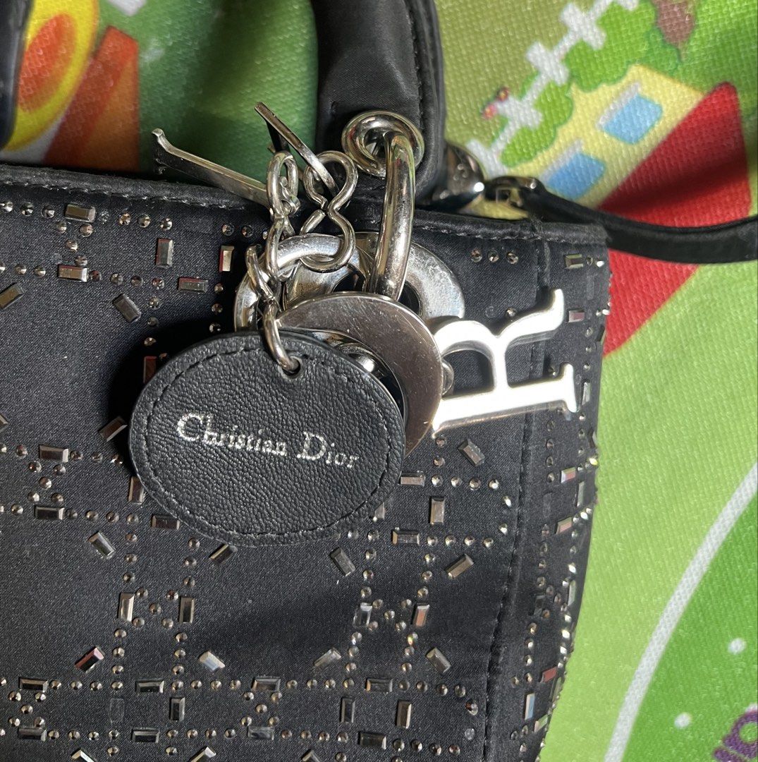 Christian Dior Beaded Lady Dior Bag (Category: Shoulder Bags) located in Lapu Lapu. Submitted by ukaydecebuofficial (Listing ID 1470801294, Image 3). Description: - Brand: Christian Dior - Color: Black with metallic bead embroidery - Pattern: Iconic cannage pattern - Hardware: Silver-tone with signature Dior charms and CD-engraved rings - Strap: Detachable black strap with engraved CD logo - Design: Classic structured top handle - Condition: Exce