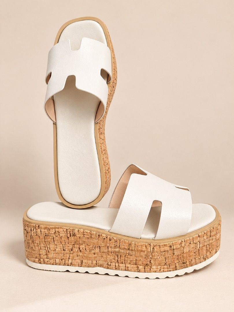 Chunky Platform Cork Sandals H-Band Slip-On (Category: Flats & Sandals) located in Pasig City. Submitted by lfboutique (Listing ID 1470769059, Image 2). Description: Pasig loc locpayment first or upon pick up Lightweight - Style: Open-toe slip-on platform sandals with a cutout H-strap upper - Sole: Thick cork-textured wedge with a flat base and ridged rubber outsole for extra grip - Colors: Available in versatile neutral solid shades - Finish: Cl