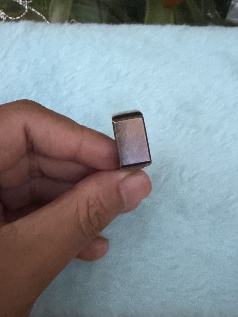Chunky signet ring with flat top face and dark finish (Category: Rings) located in Mandaue City. Submitted by chuchi152615 (Listing ID 1470920156, Image 2). Description: - Chunky signet ring with a sleek, flat rectangular face - Unique dark metallic finish with subtle color shifts in the light - Solid band design for comfortable daily wear - Clean surface with no major scratches - Versatile piece, perfect for stacking or wearing solo.