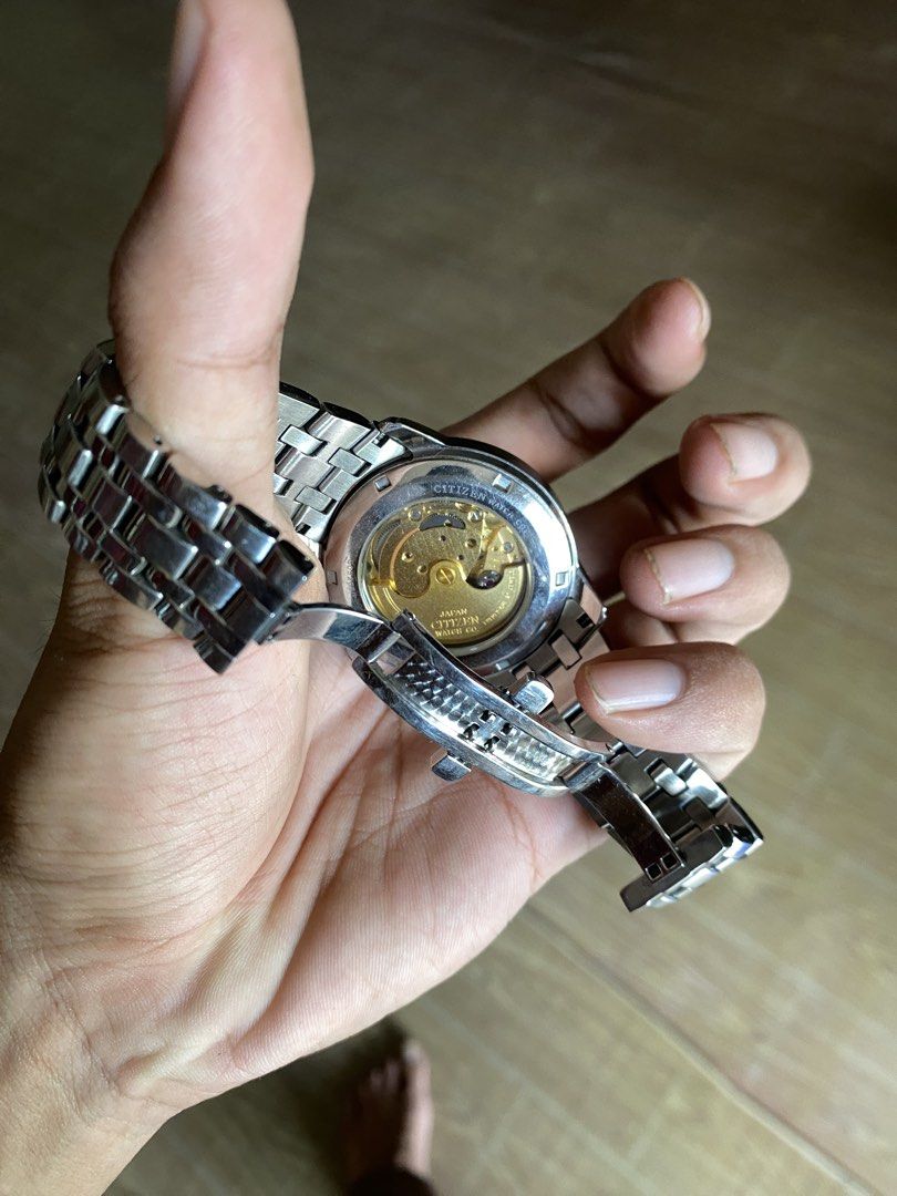 CITIZEN AUTOMATIC SAPPHIRE (Category: Luxury Watches) located in Zamboanga. Submitted by thrifted_11 (Listing ID 1470800165, Image 2). Description: Reference Number: NH8300-57E Movement: Citizen Caliber 8200 Automatic (self-winding and hand-winding) Case Size: 40 mm diameter Dial: Black / mother-of-pearl (MOP) dual-zone dial with day-date complication Water Resistance: 50 meters (5 bar).