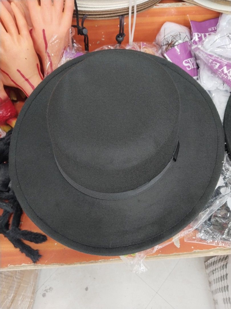 Classic Black Fedora Hat with Flat Brim (Category: Caps & Hats) located in Manila. Submitted by zdmal (Listing ID 1470928538, Image 1). Description: - Color: Solid black - Material: Sturdy felt that holds its shape well - Design: Flat brim with a matching dark ribbon band - Versatility: Easy to pair with casual outfits, formal wear, or costumes - Condition: Brand new/Excellent quality.