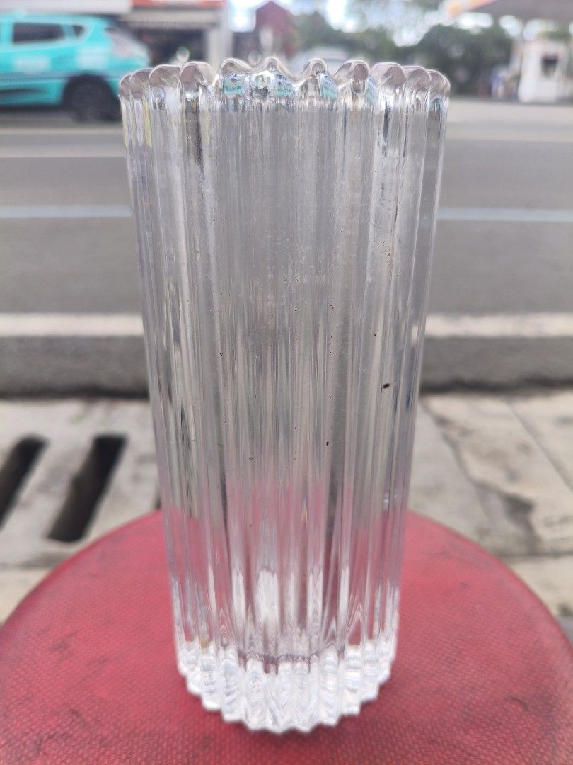 Clear Glass Fluted Vase Flower Vase (Category: Vases & Decorative Bowls) located in Manila. Submitted by tonio124 (Listing ID 1470788488, Image 1). Description: - Material: Clear glass - Design: Vertical fluted ribbing all around with a stylish scalloped rim - Base: Heavy-cut style for extra stability on flat surfaces - Versatile Use: Great for holding fresh flowers or decorative branch displays - Aesthetic: Transparent look neatly showcases flow