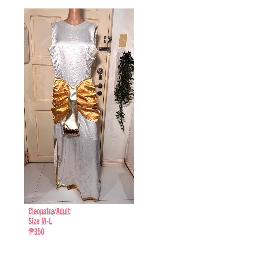 Cleopatra Costume/M-L (Category: Dresses) located in San Juan City. Submitted by matchlessgetup.ph (Listing ID 1470807939, Image 1). Description: Bring out regal Queen of the Nile vibes with this stunning, eye-catching costume! Perfect for school pageants (United Nations Day / Buwan ng Wika), themed parties, Halloween, costume competitions, or cosplay events. Includes an ornate central gold panel with detailed trim work at the hem and a matching 