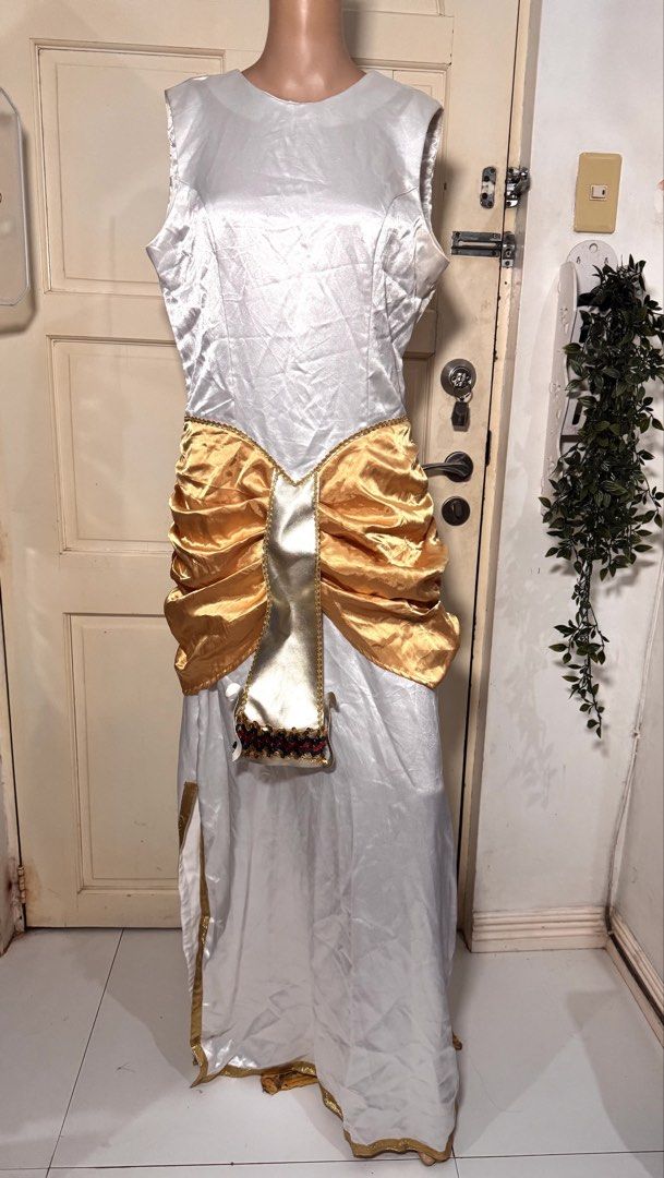 Cleopatra Costume/M-L (Category: Dresses) located in San Juan City. Submitted by matchlessgetup.ph (Listing ID 1470807939, Image 3). Description: Bring out regal Queen of the Nile vibes with this stunning, eye-catching costume! Perfect for school pageants (United Nations Day / Buwan ng Wika), themed parties, Halloween, costume competitions, or cosplay events. Includes an ornate central gold panel with detailed trim work at the hem and a matching 