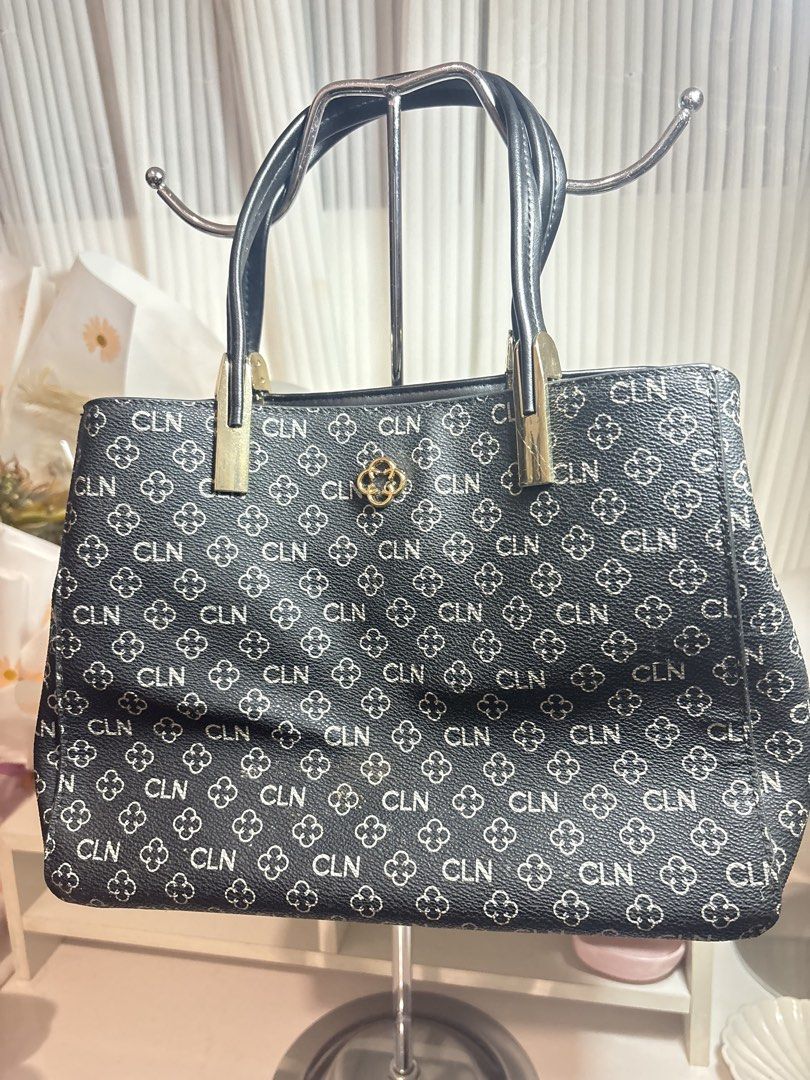 CLN Black Sling and Hand bag (Category: Luxury Bags & Wallets) located in Santo Tomas. Submitted by skyy14 (Listing ID 1470847066, Image 2). Description: - Brand: CLN - Color/Pattern: Black with all-over monogram pattern - Hardware: Gold details - Handles: Dual top handles - Interior: Multiple compartments with a middle zipped section and silky beige lining - Condition: Clean inside and out - Ideal for: Daily use, work, or school essentials No is