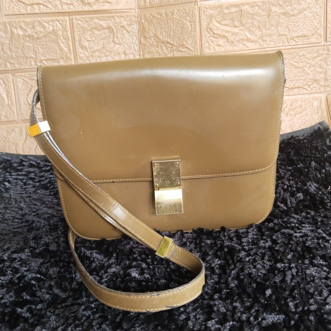 CLN leather structured crossbody bag with gold closure (Category: Cross-body Bags) located in Lubao. Submitted by dione_closet503 (Listing ID 1470786012, Image 1). Description: - Color: Olive green - Material: Structured leather with clean edge stitching - Hardware: Premium gold-tone metal clasp and strap accents - Closure: Secure flap closure - Strap: Adjustable matching leather strap - Design: Classic rectangular shape in a versatile, neutral e