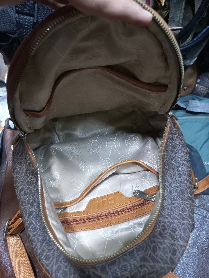 CLN Monogram Backpack Brown Tan (Category: Backpacks) located in Quezon City. Submitted by dei03_diz (Listing ID 1470845804, Image 3). Description: - Brand: CLN - Color: Brown and tan monogram with tan faux leather trim - Hardware: Gold-tone - Compartments: Main zip compartment, front zip pocket, inside zip pocket, and slip pocket - Interior: Patterned lining - Straps: Adjustable for a custom fit - Condition: Great for carrying daily essentials i