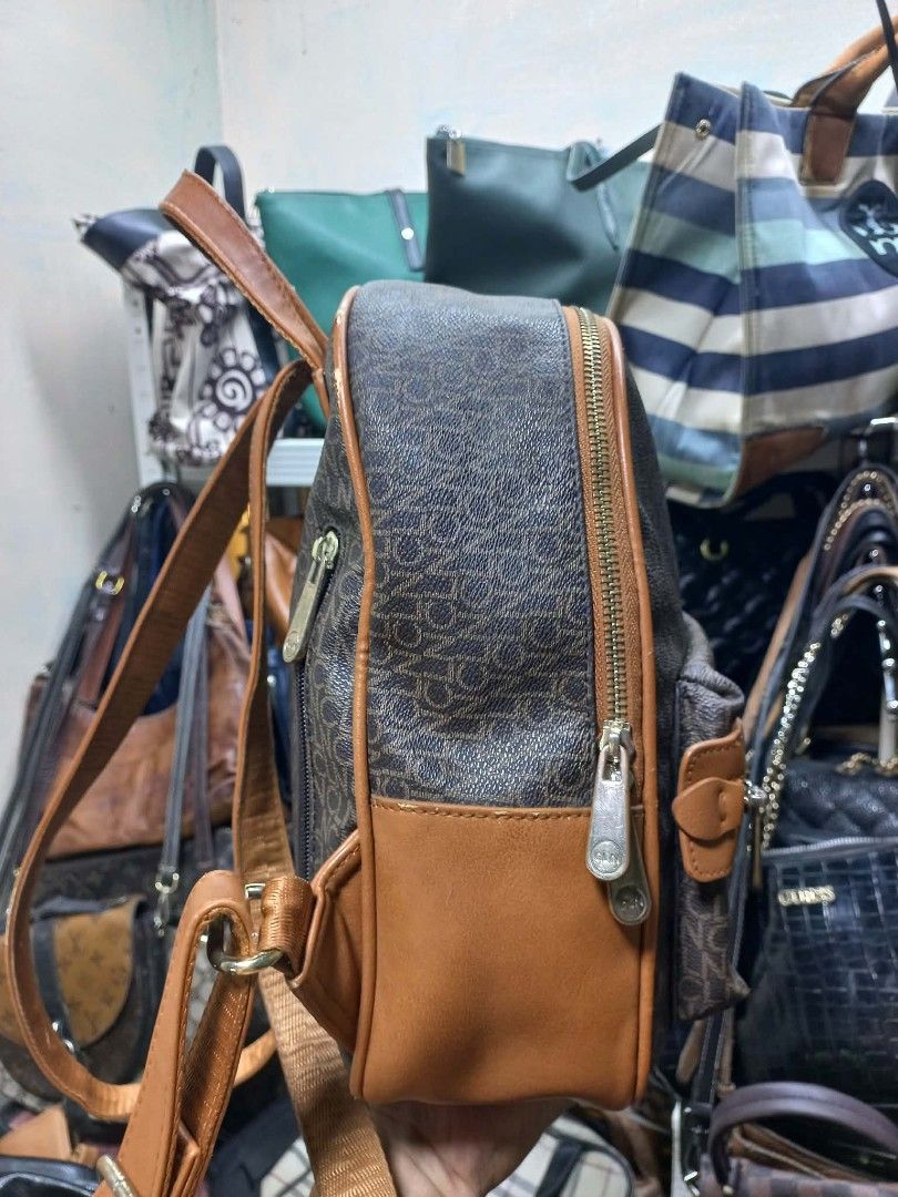 CLN Monogram Backpack Brown Tan (Category: Backpacks) located in Quezon City. Submitted by dei03_diz (Listing ID 1470845804, Image 2). Description: - Brand: CLN - Color: Brown and tan monogram with tan faux leather trim - Hardware: Gold-tone - Compartments: Main zip compartment, front zip pocket, inside zip pocket, and slip pocket - Interior: Patterned lining - Straps: Adjustable for a custom fit - Condition: Great for carrying daily essentials i