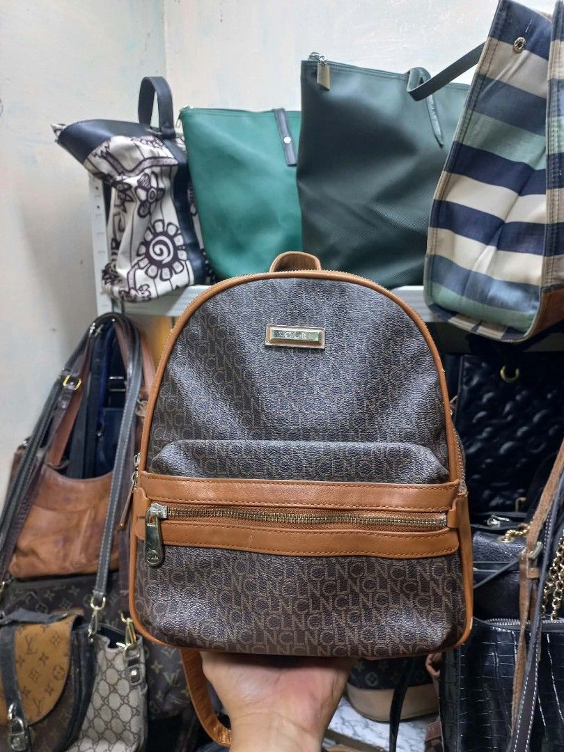 CLN Monogram Backpack Brown Tan (Category: Backpacks) located in Quezon City. Submitted by dei03_diz (Listing ID 1470845804, Image 1). Description: - Brand: CLN - Color: Brown and tan monogram with tan faux leather trim - Hardware: Gold-tone - Compartments: Main zip compartment, front zip pocket, inside zip pocket, and slip pocket - Interior: Patterned lining - Straps: Adjustable for a custom fit - Condition: Great for carrying daily essentials i
