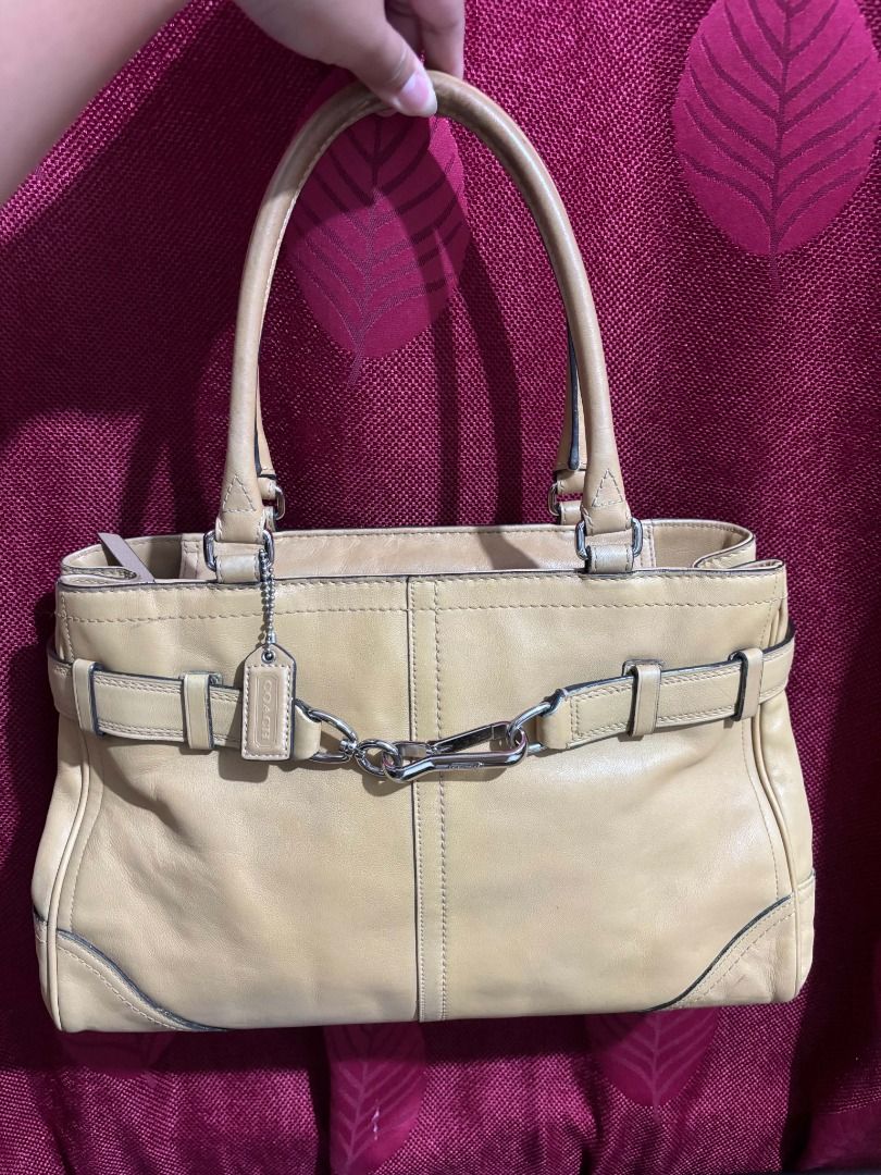 Coach Hampton Leather Tote Bag Tan (Category: Luxury Bags & Wallets) located in Taguig. Submitted by classicurations (Listing ID 1470835142, Image 1). Description: Tan leather tote bag. Dual top handles and silver tone hardware. Front clasp closure with matching belt detail. Includes Coach hangtag. Interior creed patch reads style number A0851-F11200, crafted in China from natural cowhide leather. Fabric lined interior with zip pocket. Shows mino