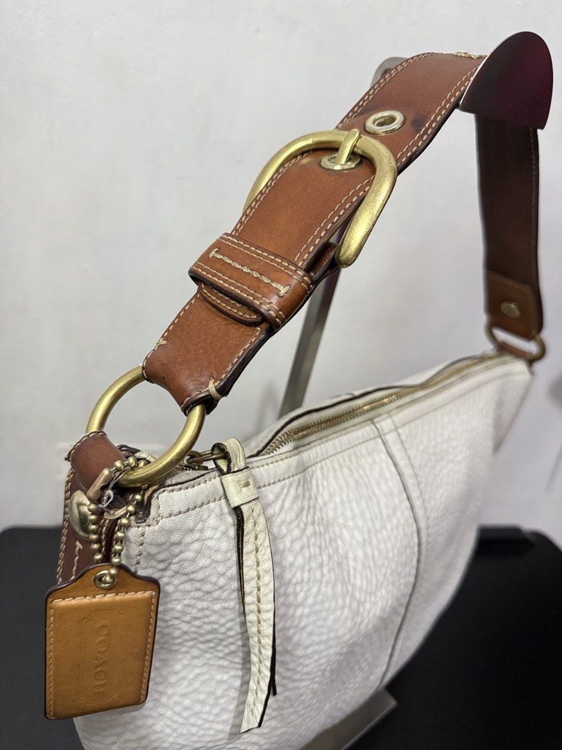 Coach Hobo Shoulder Bag (Category: Luxury Bags & Wallets) located in Cainta. Submitted by angellyy_ (Listing ID 1470878646, Image 3). Description: Coach Hobo Pebbled Leather Semi Med Size Flaws - Dryness on leather, some fading on hardware, rubber lining on strap connectors Condition- 7.5/10 Very vintage look No flaws on interior .