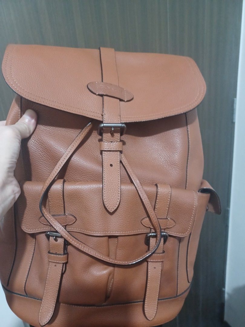 Coach Leather Backpack Tan Brown (Category: Backpacks) located in Mandaluyong City. Submitted by usamenfashionhaul (Listing ID 1470916341, Image 3). Description: - Authentic Coach leather backpack in a stylish tan brown color - Premium pebbled leather texture with secure flap closure and buckle straps - Convenient exterior pockets for quick-access items - Breathable mesh back panel and adjustable leather shoulder straps for all-day comfort - Dura
