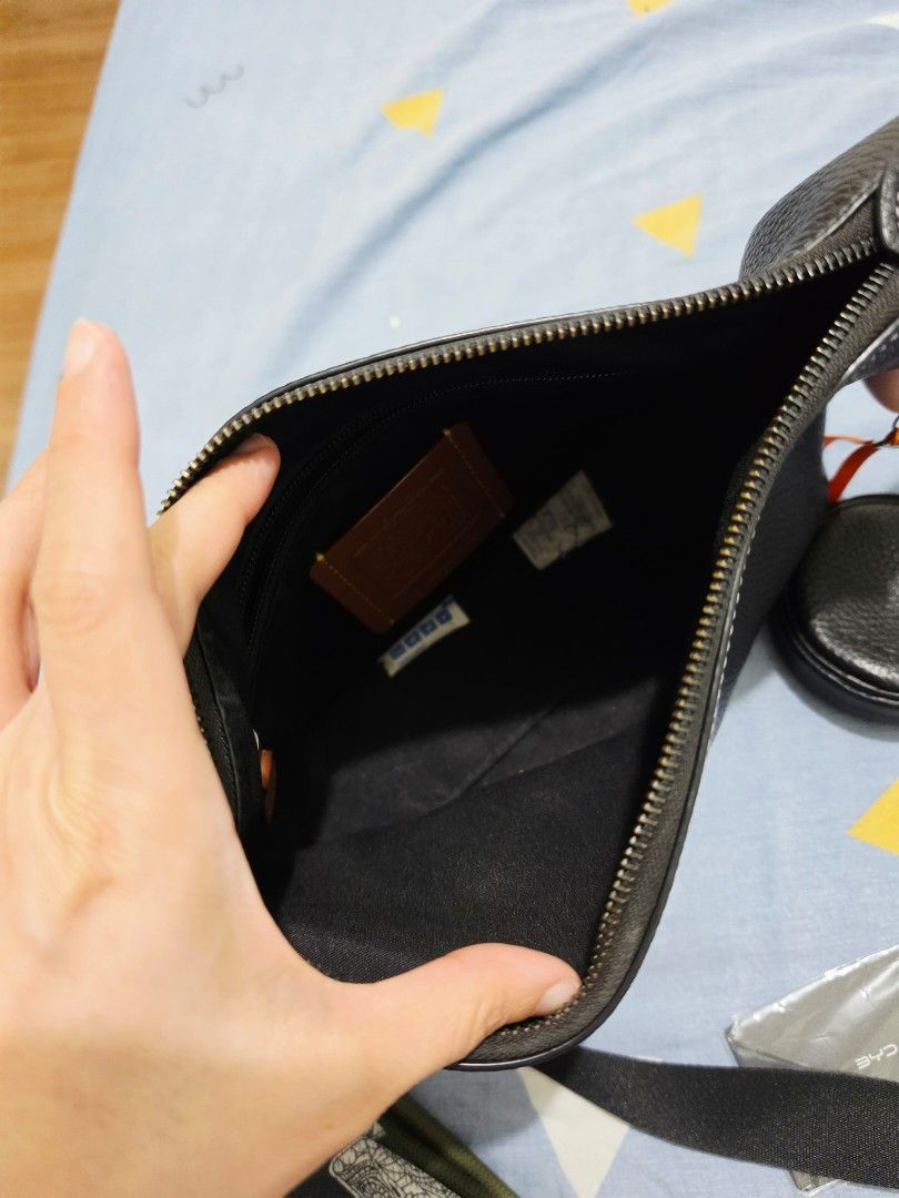 Coach Leather Crossbody Bag Black (Category: Cross-body Bags) located in Makati City. Submitted by lesleylorraine0103 (Listing ID 1470749955, Image 3). Description: - Brand: Coach - Material: Premium textured pebble leather in classic black - Hardware: Elegant gold-tone zippers - Features: Adjustable black strap, exterior zip pocket, and a detachable matching round coin pouch - Interior: Fabric lining with an inner zipper pocket and Coach leather