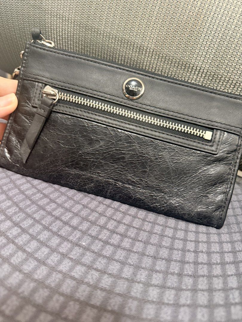 Coach Leather Wristlet Wallet Black Multicolored Interior (Category: Wallets & Card holders) located in Marikina City. Submitted by ukayshopping (Listing ID 1470824624, Image 2). Description: - Authentic black leather Coach wristlet (Brand new with tags!) - Silver-tone hardware & secure zip-top closure - Convenient detachable wrist strap - Front zip pocket with iconic Coach New York metal logo plate - Vibrant, colorful striped fabric interior - B