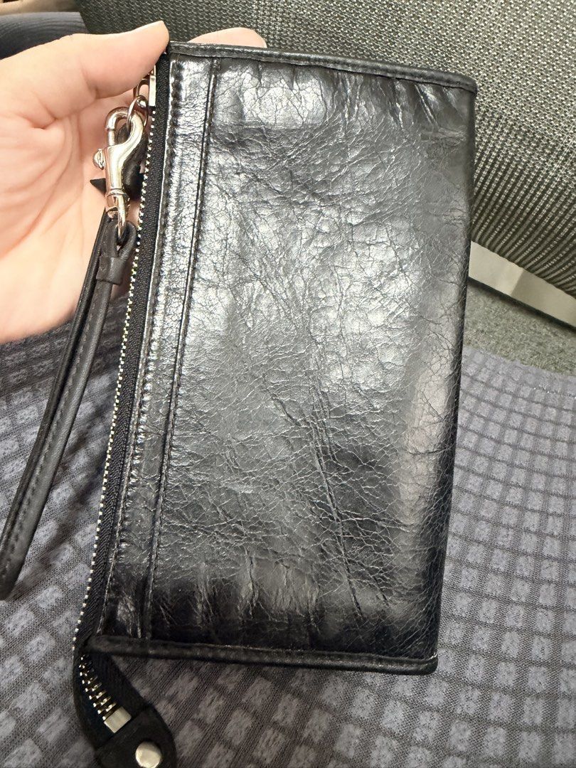 Coach Leather Wristlet Wallet Black Multicolored Interior (Category: Wallets & Card holders) located in Marikina City. Submitted by ukayshopping (Listing ID 1470824624, Image 3). Description: - Authentic black leather Coach wristlet (Brand new with tags!) - Silver-tone hardware & secure zip-top closure - Convenient detachable wrist strap - Front zip pocket with iconic Coach New York metal logo plate - Vibrant, colorful striped fabric interior - B