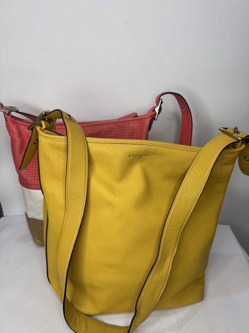 Coach Legacy Duffle Bag BUNDLE (Category: Luxury Bags & Wallets) located in Cagayan de Oro. Submitted by KoaApparelAtbp. (Listing ID 1470799396, Image 1). Description: Coach Legacy Perforated Rugby Stripe Duffle Bag and Coach Legacy Leather Duffle yellow. Has sign of wears in the corner. .