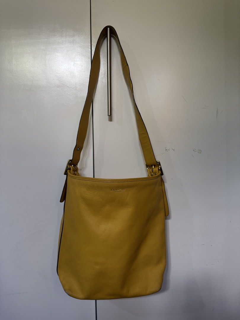 Coach legacy yellow (Category: Luxury Bags & Wallets) located in Cagayan de Oro. Submitted by KoaApparelAtbp. (Listing ID 1470805119, Image 1). Description: Individual detail of coach yellow duffle legacy bag. Clean. .