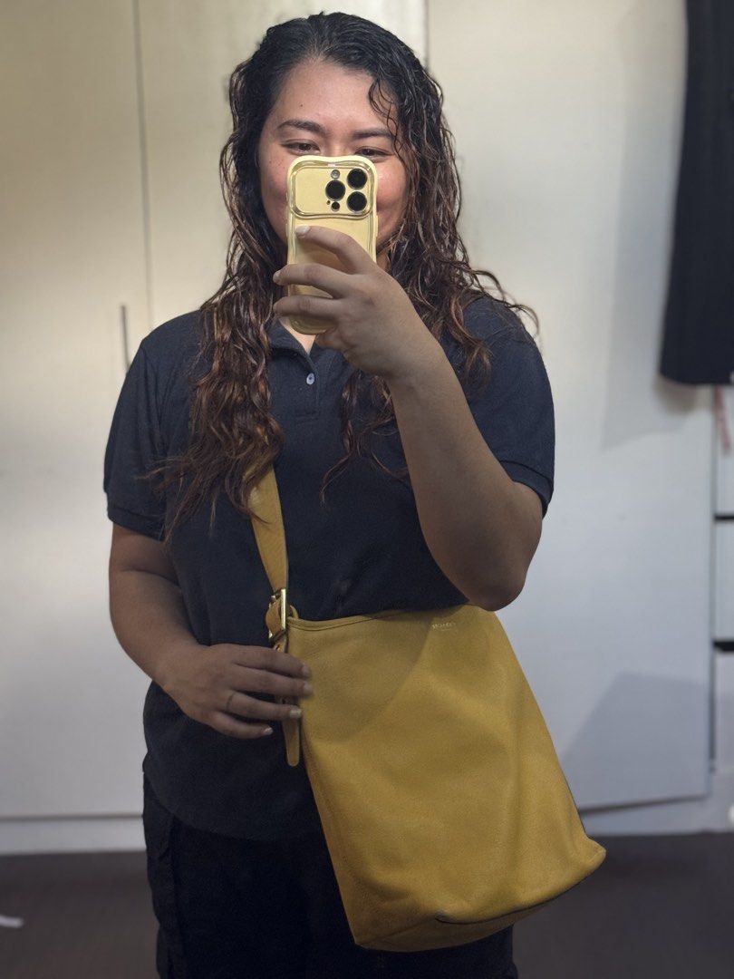 Coach legacy yellow (Category: Luxury Bags & Wallets) located in Cagayan de Oro. Submitted by KoaApparelAtbp. (Listing ID 1470805119, Image 3). Description: Individual detail of coach yellow duffle legacy bag. Clean. .