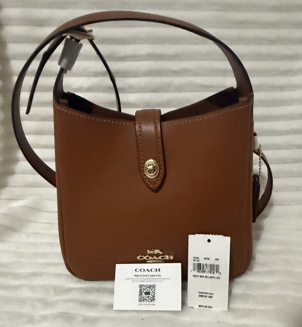 Coach Mini Hadley Bag (Category: Luxury Bags & Wallets) located in Las Pinas. Submitted by purse.vanity (Listing ID 1470832672, Image 1). Description: - Brand: Coach - Style: Leather bucket bag - Color: Rich saddle brown with gold-tone hardware - Condition: Brand new with tags still attached - Features: Structured shape, signature metal logo, and center turn-lock strap closure - Interior: Fabric lining with an inside zip pocket Adjustable strap c