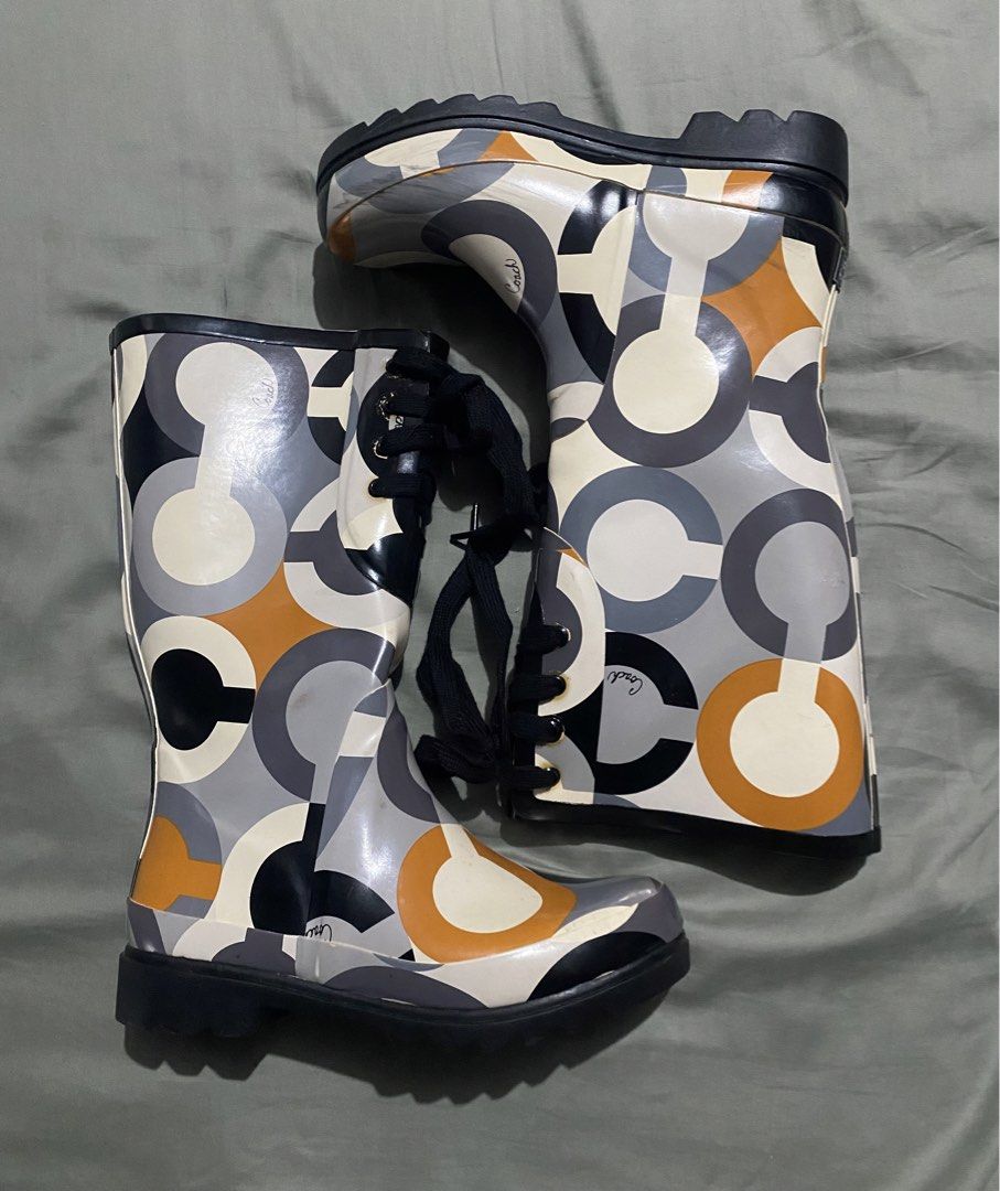 Coach Rain Boots (Category: Boots) located in Naga. Submitted by junked_garments_v2 (Listing ID 1470851603, Image 1). Description: Coach Rain Boots Excellent Condition Minimal Signs Of Use Need Cleaning Size 7 US Dm me to purchase!.