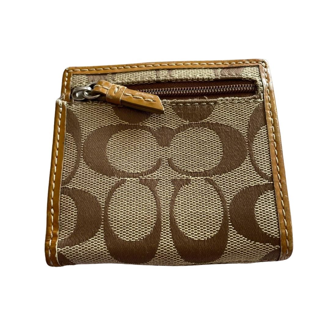 Coach Signature C Brown Tan Small Wallet (Category: Wallets & Card holders) located in Davao. Submitted by ghoulsnightincloset (Listing ID 1470857464, Image 3). Description: .•COLOR: Brown/Beige Signature Canvas with Tan Leather Trim (Lavender Interior) .•STYLE: Compact Bifold Wallet with Back Zippered Coin Purse & ID Window .•CONDITION: Preloved with signs of use, minor rubbing on leather/edges, but fully functional ୨୧ PRE-ORDER FROM JAPAN 🇯🇵 